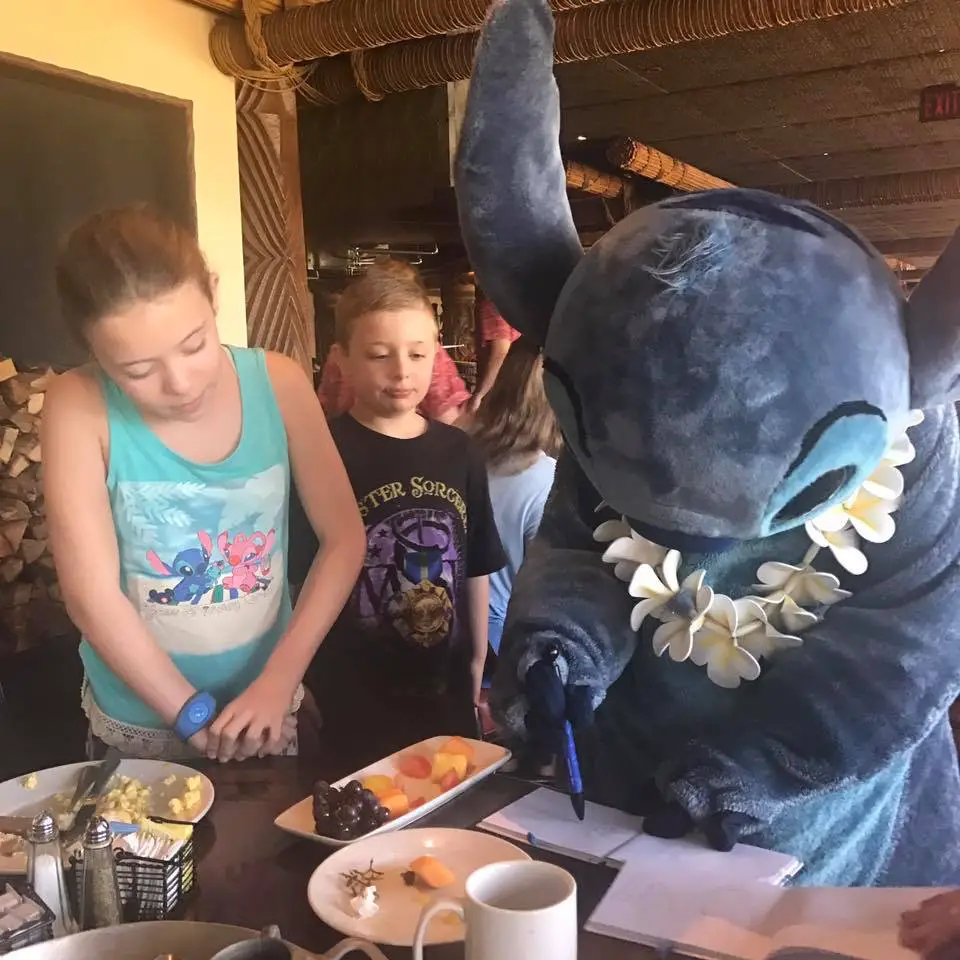 Stitch signing our Disney World Autograph Book