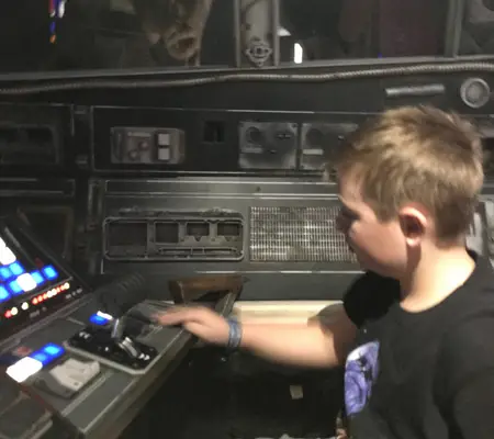 My son at the Pilot controls of the Cockpit.
