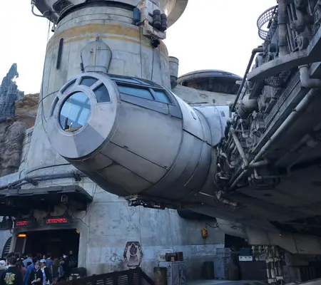 The Millennium Falcon and entrance for the Smugglers Run ride at Star Wars Galaxy's Edge.