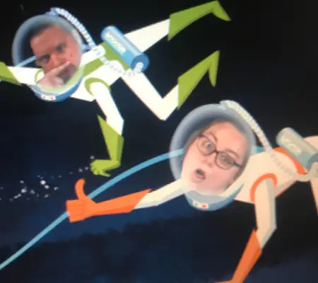 Our faces superimposed onto the Spaceship Earth video at the end of the ride inside the Epcot Ball.