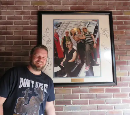 Me beside the signed photo of the Dedication ceremony