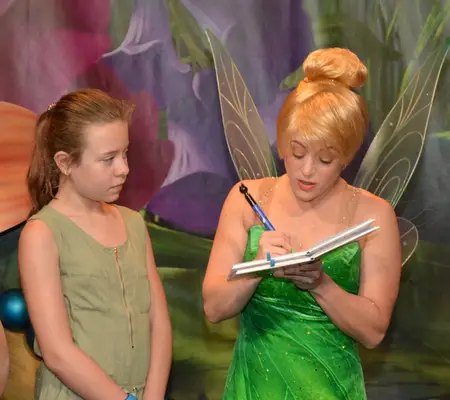 Getting Tinker Bell's autograph at Disney World